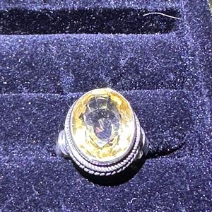 Elegant Silver and Yellow Gemstone Ring